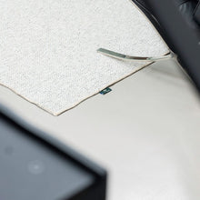 Load image into Gallery viewer, Cicada carpet by New Weave, made with ECONYL® regenerated nylon, shown in a living room setting.