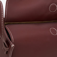 Charger l'image dans la galerie, Close-up of a brown bag, made with ECONYL® regenerated nylon, with white stitching on a white background