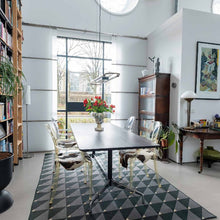 Load image into Gallery viewer, Phoenix carpet by New Weave with a geometric checkered pattern, made with ECONYL® regenerated nylon, placed in a living room setting.