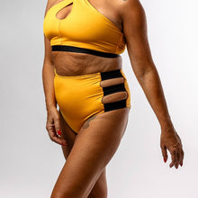 Load image into Gallery viewer, Person wearing a yellow swimsuit with black accents on a plain background