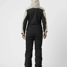 Load image into Gallery viewer, A female model wearing a green and black ski suit by Hey Sport, made with ECONYL® regenerated nylon.”