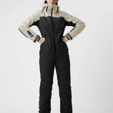 Load image into Gallery viewer, A female model wearing a green and black ski suit by Hey Sport, made with ECONYL® regenerated nylon.