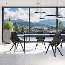 Charger l'image dans la galerie, Living room with black Noho Move chairs made with ECONYL® regenerated nylon.