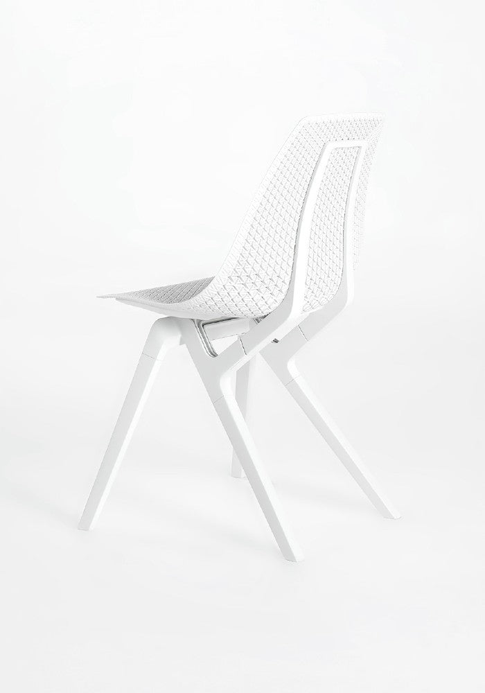 Innovative white Noho Move chair with a textured seat and sleek legs, made with ECONYL® regenerated nylon.