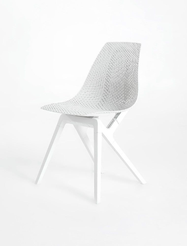 Innovative white Noho Move chair with a textured seat and sleek legs, made with ECONYL® regenerated nylon.