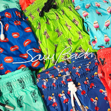 Load image into Gallery viewer, Colorful swim made with econyl nylon trunks with various patterns on a checkered background, featuring the brand 'Sam Badin'.