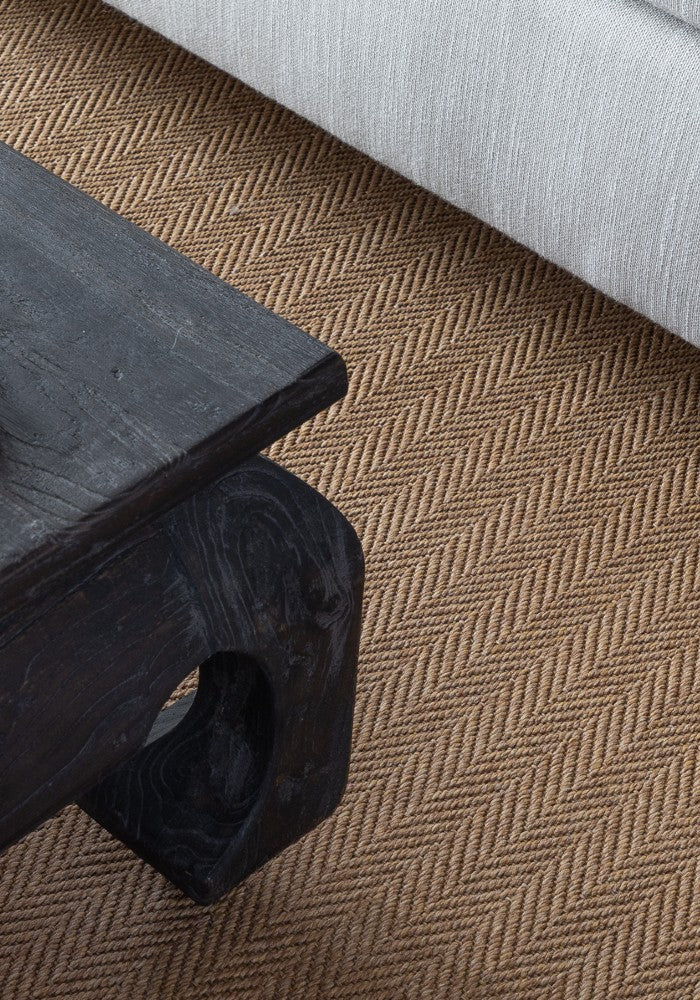 A stylish rug by Synsisal, made from ECONYL® regenerated nylon, in a living room setting