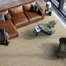 Charger l'image dans la galerie, A stylish rug by Synsisal, made from ECONYL® regenerated nylon, in a living room setting with sofa