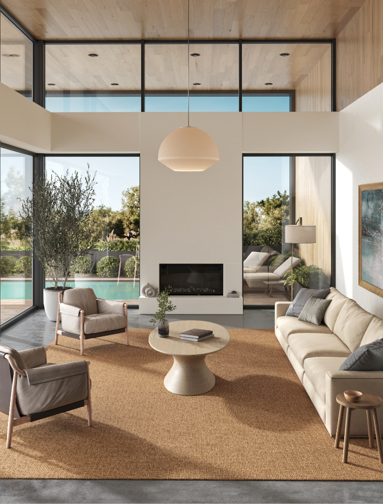 A stylish rug by Synsisal, made from ECONYL® regenerated nylon, in a modern living room setting with sofa
