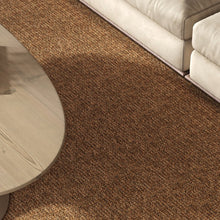 Load image into Gallery viewer, A stylish rug by Synsisal, made from ECONYL® regenerated nylon, in a modern living room setting with sofa