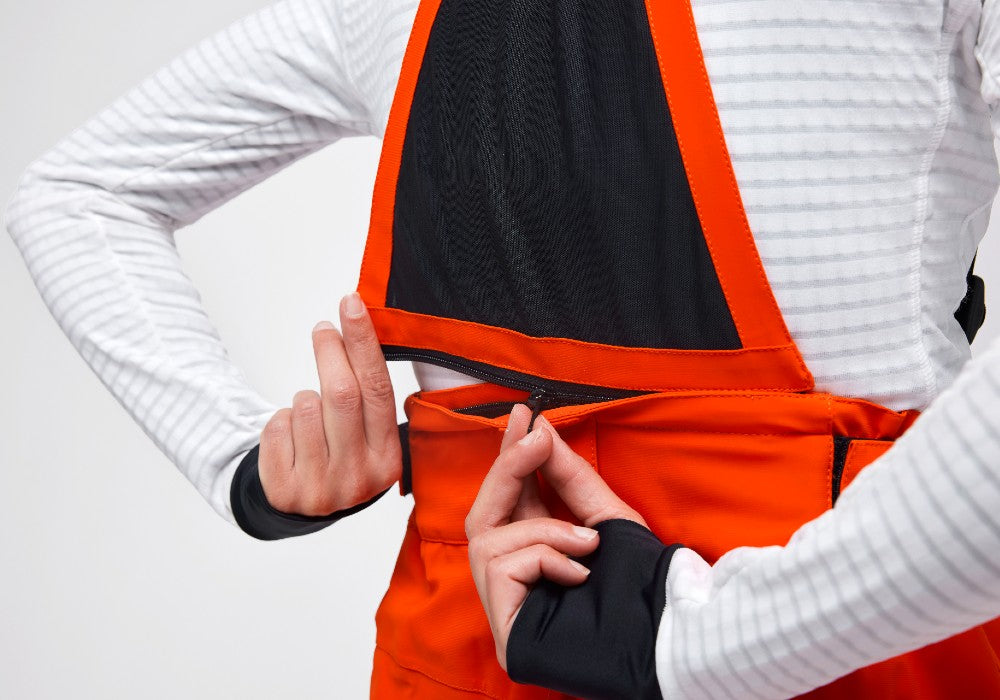 Zipper detail of the Crested Pants Hey Sport color Orange made with ECONYL® regenerated nylon