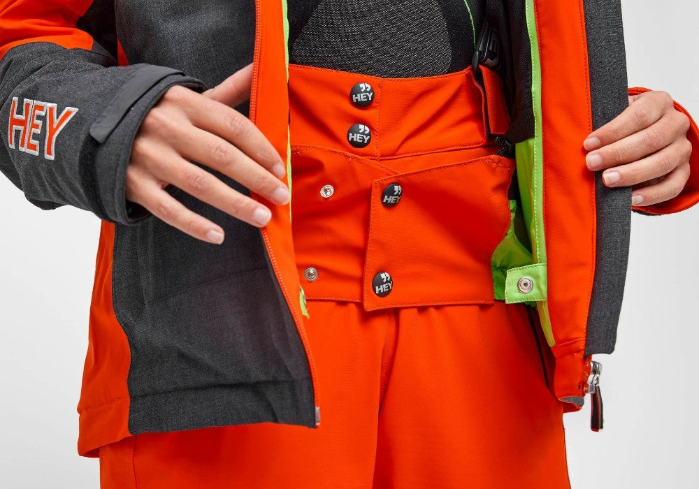 Buttons detail of the Crested Pants Hey Sport color Orange made with ECONYL® regenerated nylon