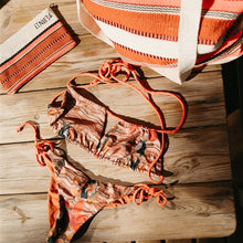Charger l'image dans la galerie, An orange and beige patterned string bikini crafted with ECONYL® regenerated nylon
