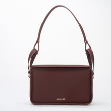 Charger l'image dans la galerie, Conscious brown crossbody bag featuring ECONYL® regenerated nylon, isolated on white.
