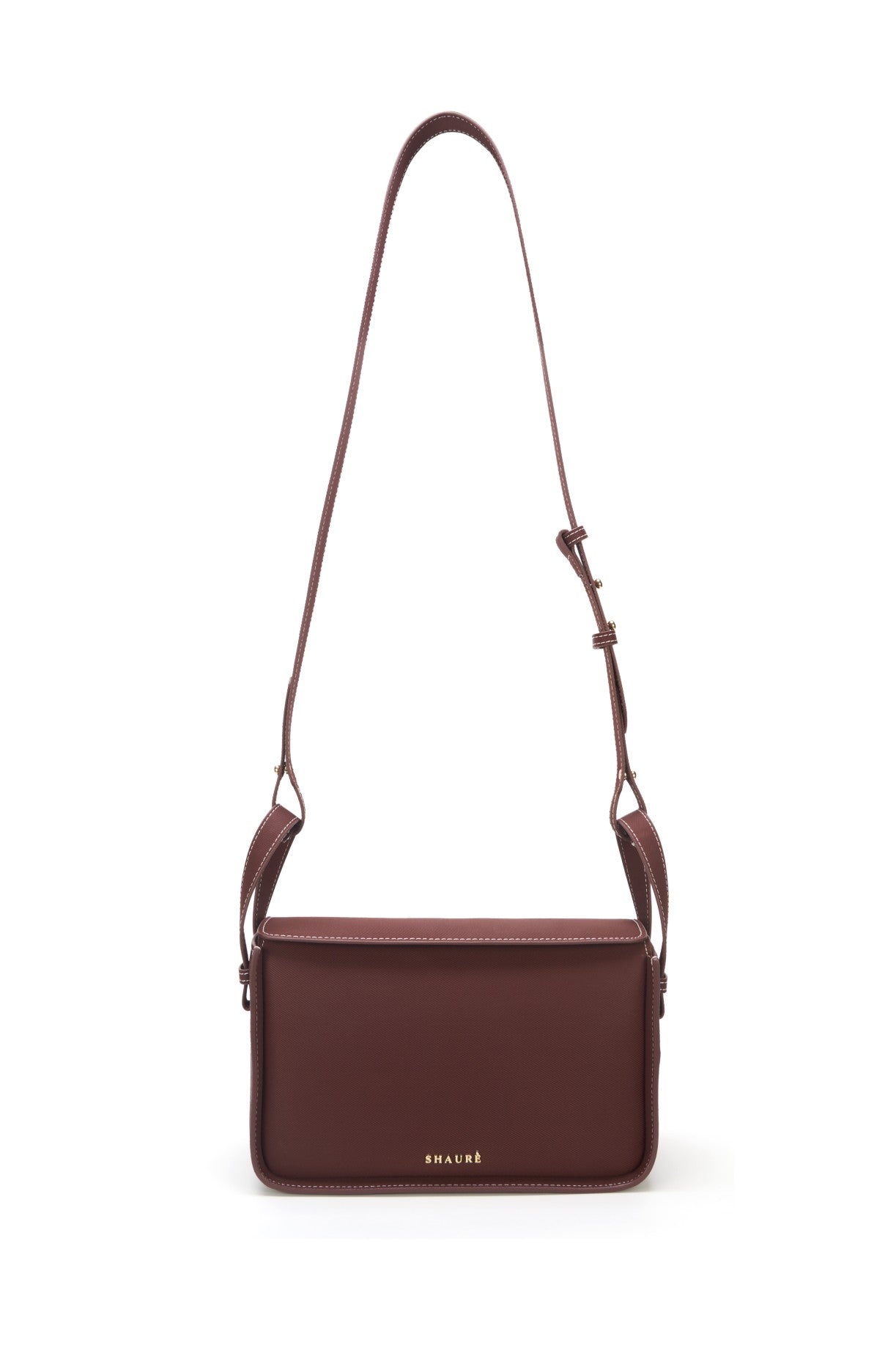 Responsible brown crossbody bag featuring ECONYL® regenerated nylon, isolated on white.
