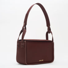Charger l'image dans la galerie, Conscious brown crossbody bag featuring ECONYL® regenerated nylon, isolated on white.
