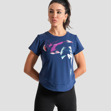 Load image into Gallery viewer, A woman modeling a blue short-sleeve athletic t-shirt with a colorful abstract graphic print on the front, made with ECONYL®nylon, by the brand GoofyPRO
