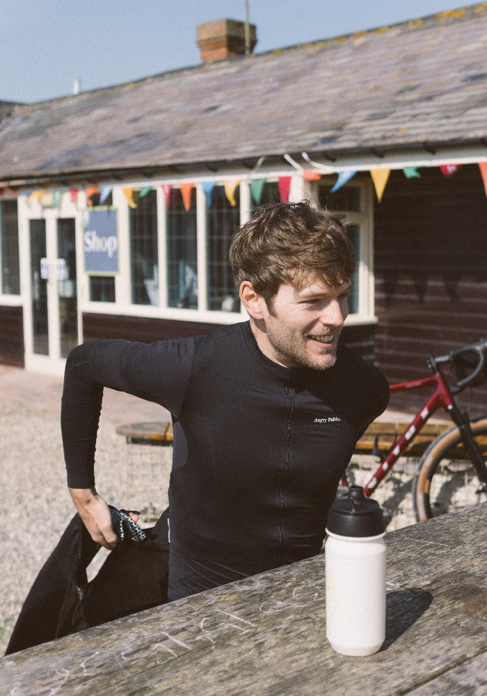 Man wearing the Angry Pablo EarthTone Riding Jersey color Black made with ECONYL® regenerated nylon