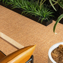 Charger l'image dans la galerie, Brown woven surface with a chair and potted plant. Rug by Synsisal made with ECONYL® regenerated nylon
