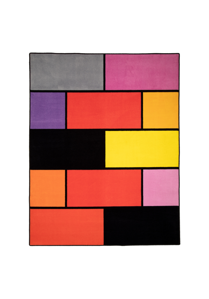 A colorful geometric carpet with bold blocks of color. Limited edition art piece by Ugo Rondinone, made with ECONYL® yarn.