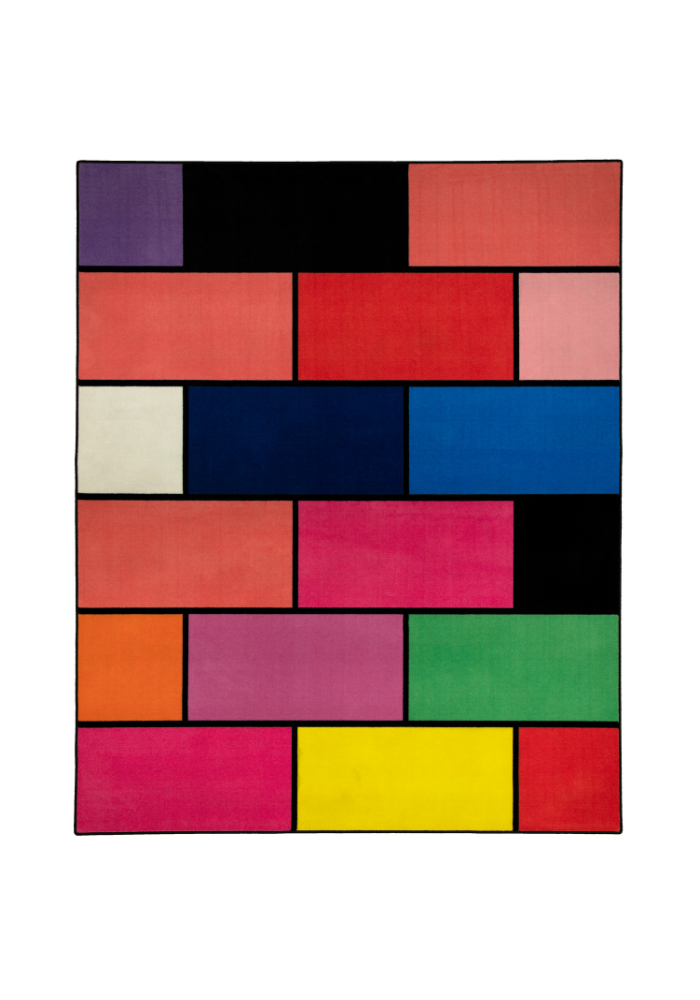 A colorful geometric carpet with bold blocks of color. Limited edition art piece by Ugo Rondinone, made with ECONYL® yarn.