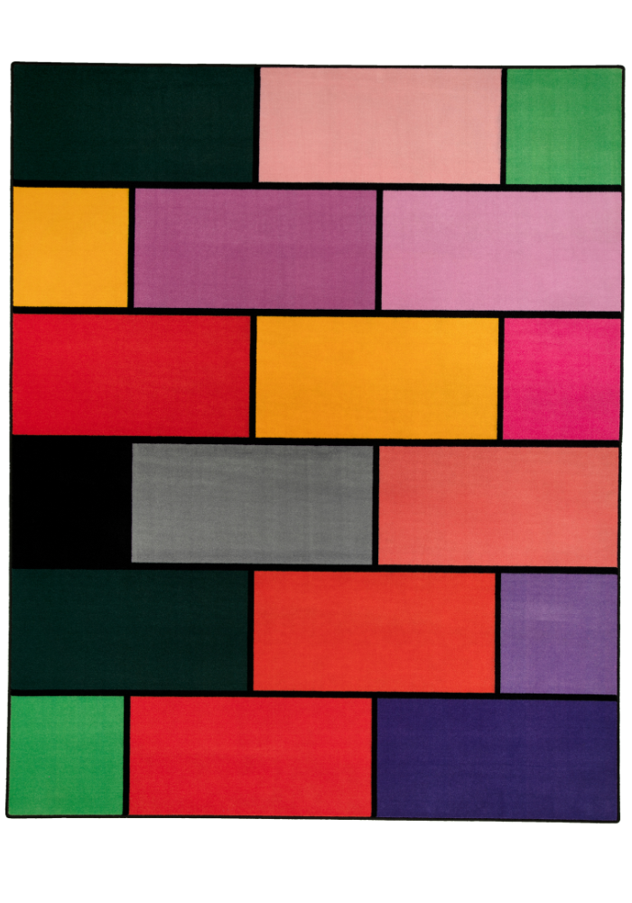 A colorful geometric carpet with bold blocks of color. Limited edition art piece by Ugo Rondinone, made with ECONYL® yarn.