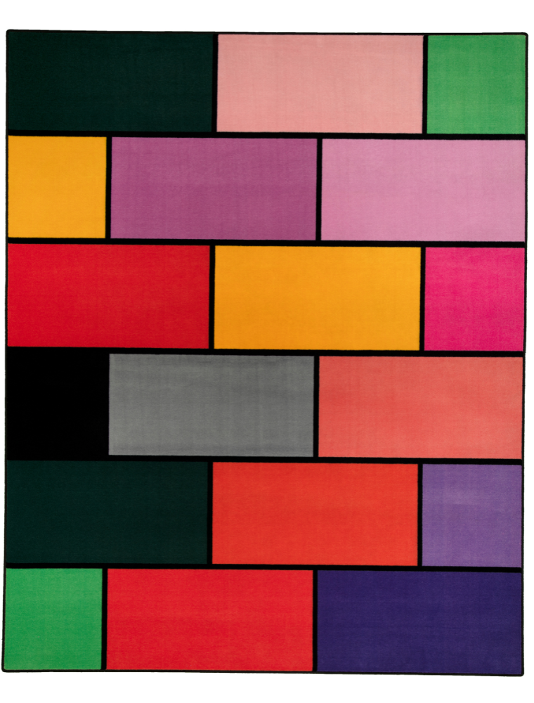 A colorful geometric carpet with bold blocks of color. Limited edition art piece by Ugo Rondinone, made with ECONYL® yarn.