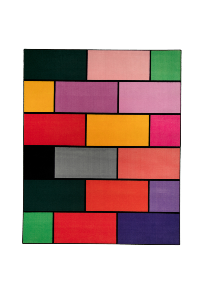 A colorful geometric carpet with bold blocks of color. Limited edition art piece by Ugo Rondinone, made with ECONYL® yarn.
