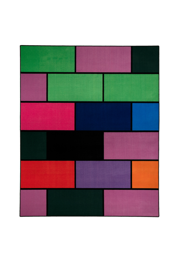 A colorful geometric carpet with bold blocks of color. Limited edition art piece by Ugo Rondinone, made with ECONYL® yarn.