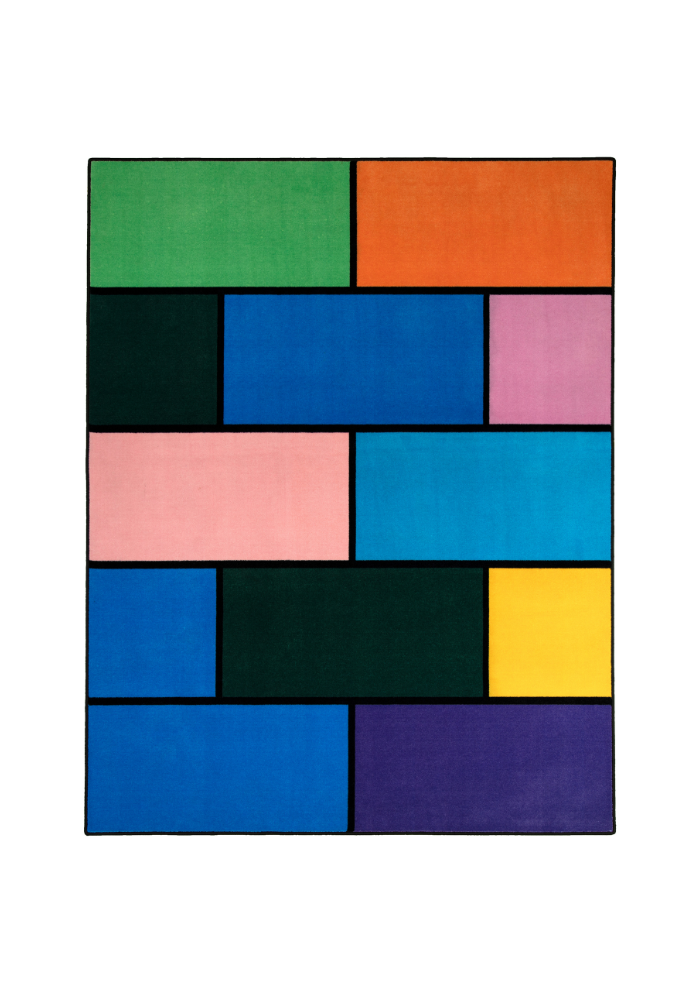 A colorful geometric carpet with bold blocks of color. Limited edition art piece by Ugo Rondinone, made with ECONYL® yarn.
