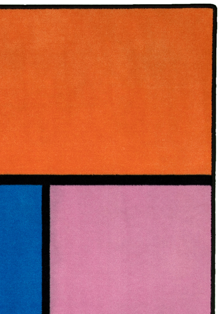 A colorful geometric carpet with bold blocks of color. Limited edition art piece by Ugo Rondinone, made with ECONYL® yarn.