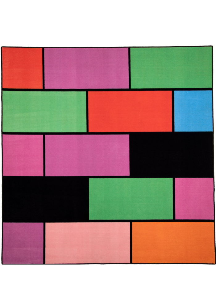 A colorful geometric carpet with bold blocks of color. Limited edition art piece by Ugo Rondinone, made with ECONYL® yarn.