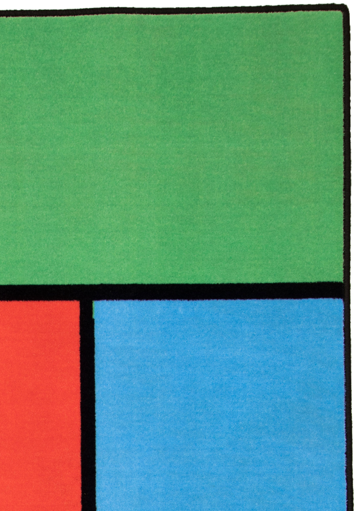 A colorful geometric carpet with bold blocks of color. Limited edition art piece by Ugo Rondinone, made with ECONYL® yarn.