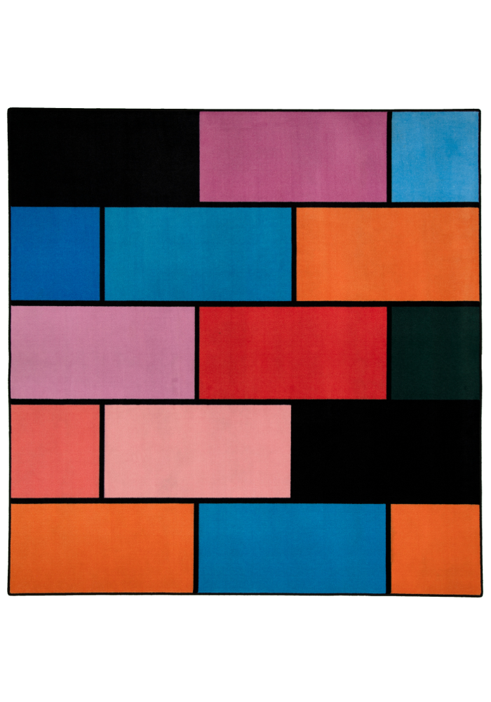 A colorful geometric carpet with bold blocks of color. Limited edition art piece by Ugo Rondinone, made with ECONYL® yarn.