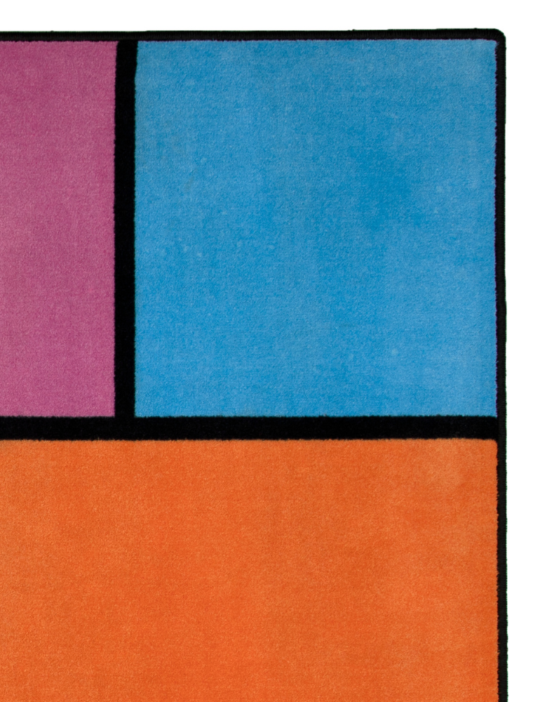 A colorful geometric carpet with bold blocks of color. Limited edition art piece by Ugo Rondinone, made with ECONYL® yarn.