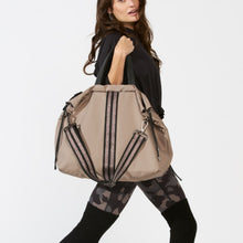 Load image into Gallery viewer, Woman carrying a ACE Tote Bag color Taupe made with ECONYL® regenerated nylon
