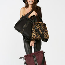 Load image into Gallery viewer, Woman carrying a ACE Urban Tote Bag various colors made with ECONYL® regenerated nylon
