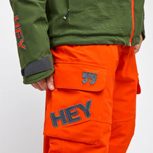 Load image into Gallery viewer, Pocket detail of the Alyeska-Ecoball Pants Hey Sport color Orange made with ECONYL® regenerated nylon
