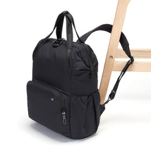 Charger l&#39;image dans la galerie, Side view of the Pacsafe Citysafe CX Anti-Theft Backpack color Black made with ECONYL® regenerated nylon locked to a chair
