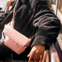 Charger l&#39;image dans la galerie, Everyday with the Pacsafe Citysafe CX Anti-Theft Convertible Crossbody color Rose made with ECONYL® regenerated nylon
